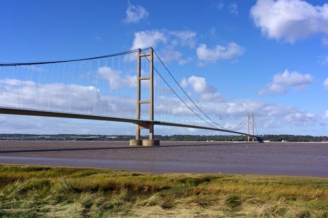 The Humber Bridge spanning the estuary, seen from the bank near Barton-upon-Humber