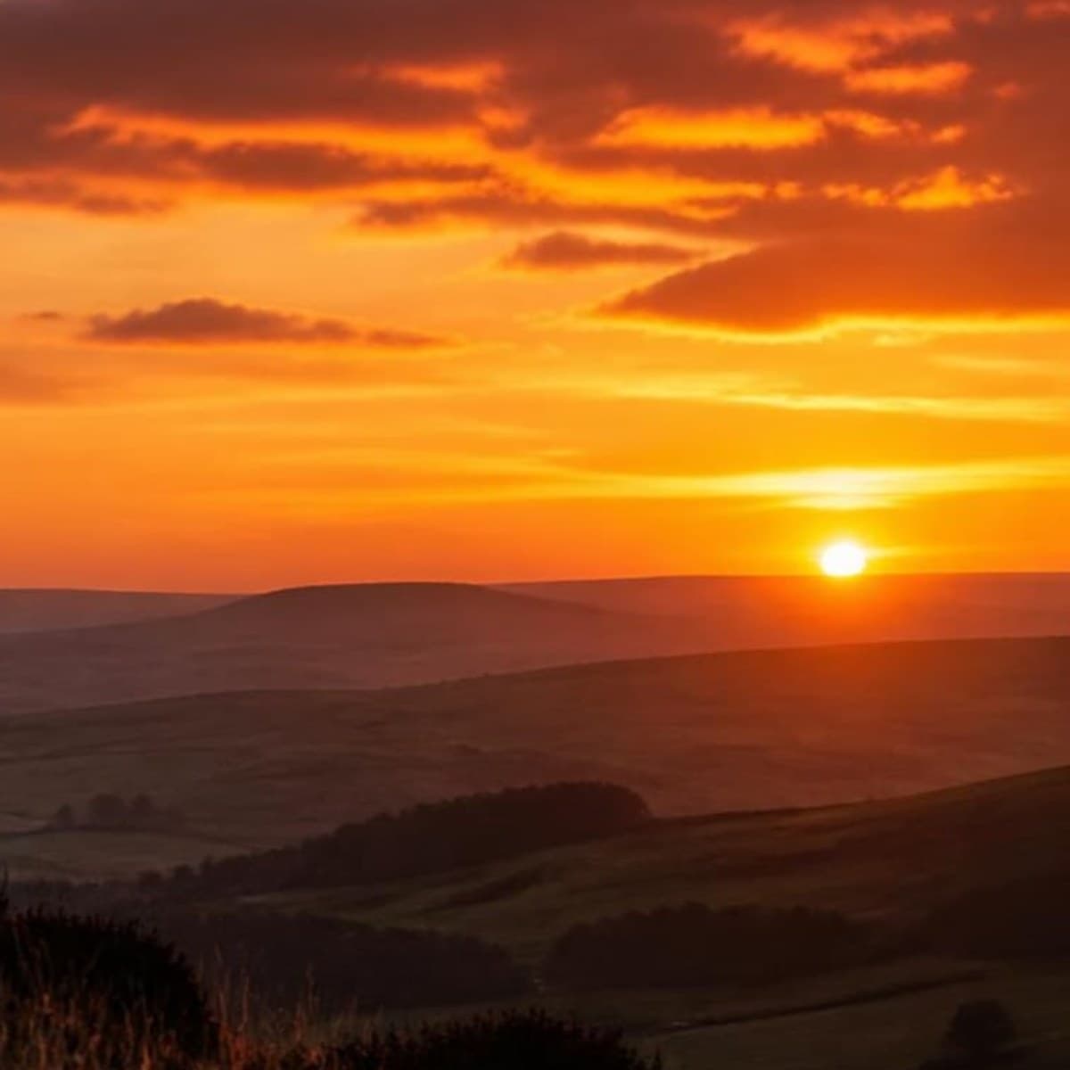 Rolling hills and farmland across the Yorkshire countryside at sunset