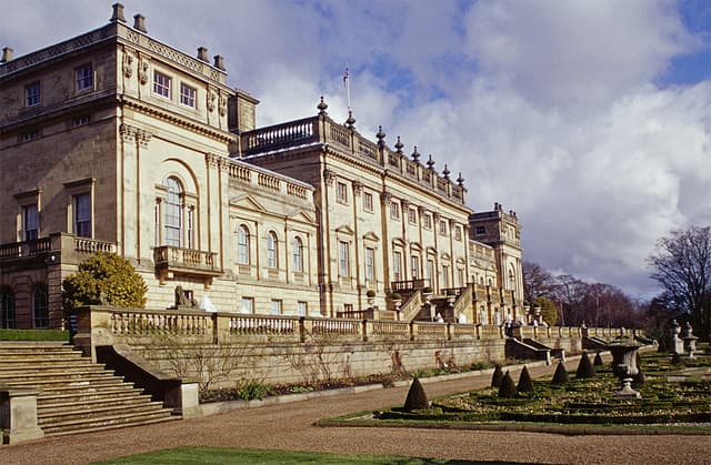 The stone facade and terraced gardens of Harewood House near Leeds